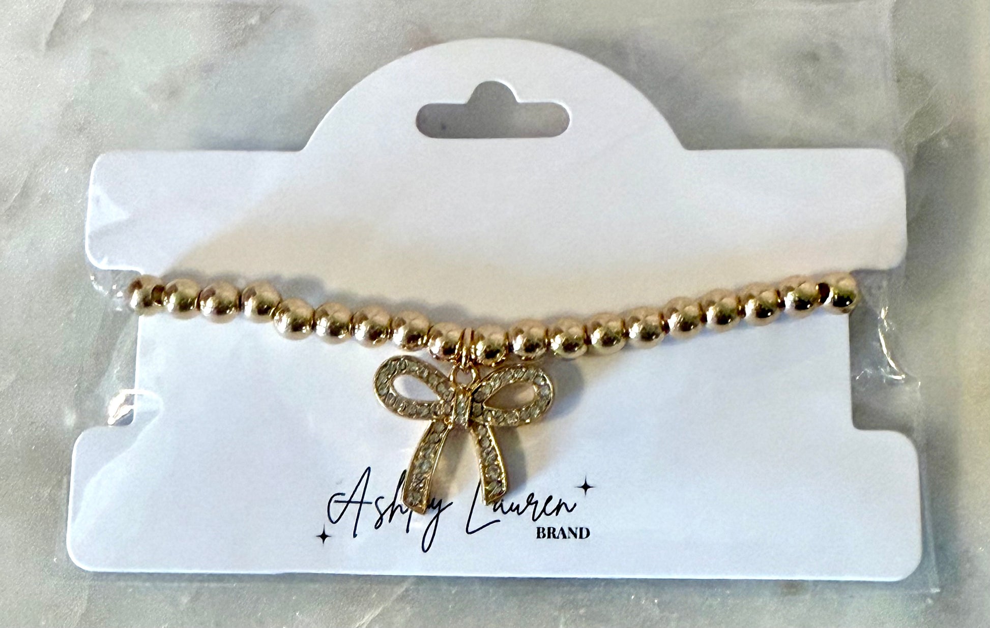 Gold Bow Bracelet - Ashley Lauren